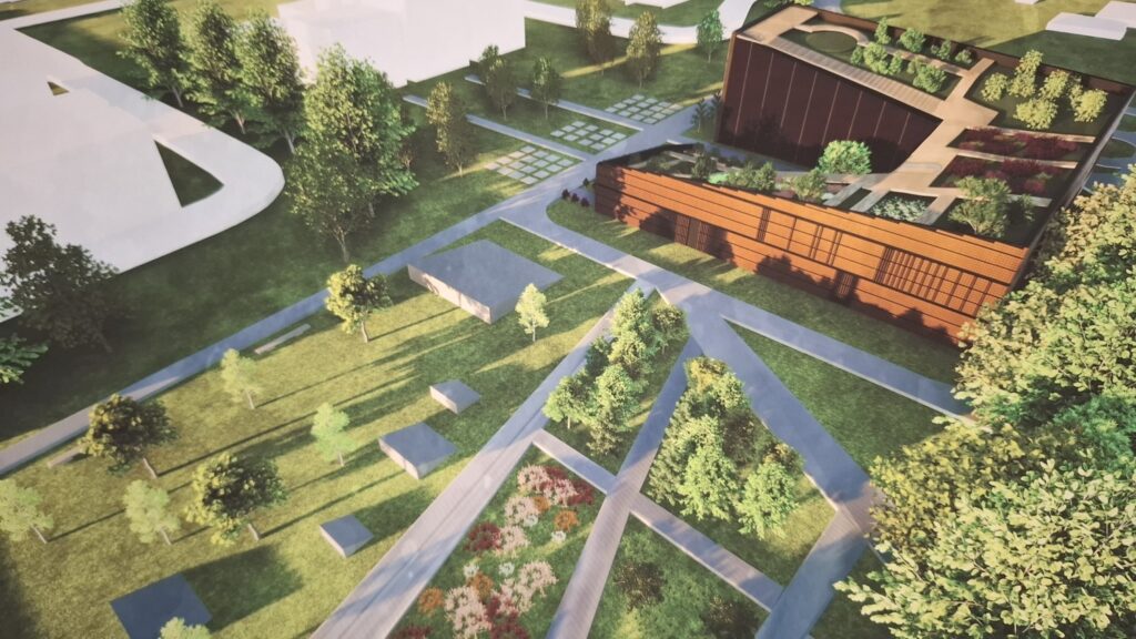 Wizualizacja projektu Ekofuturium z lotu ptaka. Zabudowania i ścieżki spacerowe pośród drzew.